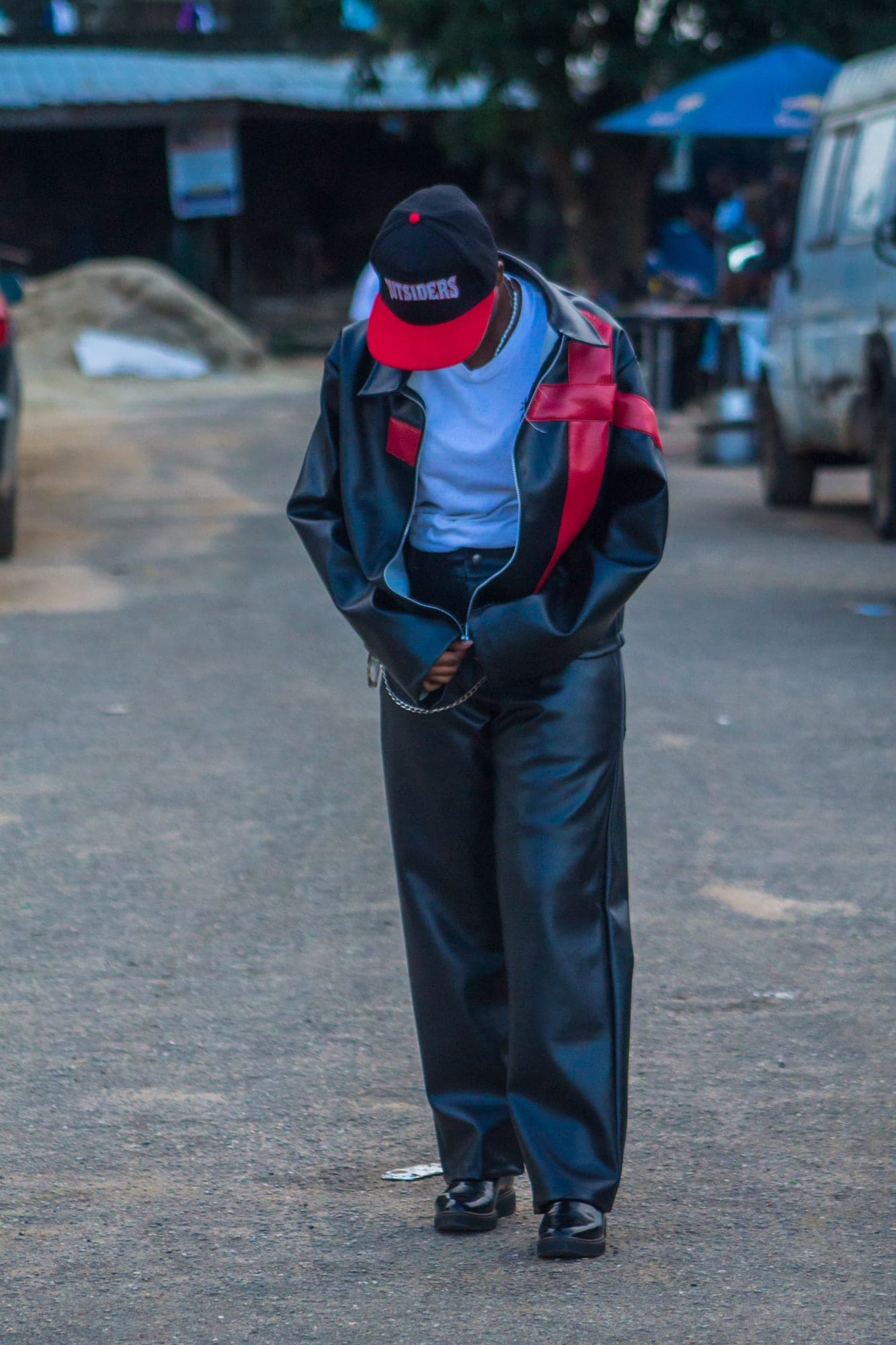 Leather jacket and trousers, looking down on a street