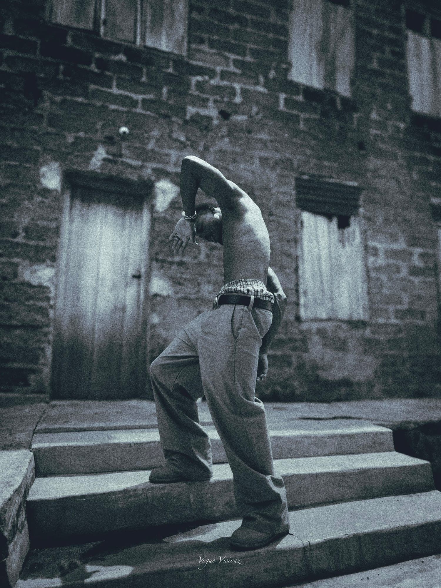 Black and white shot of wide-leg trousers on stone steps
